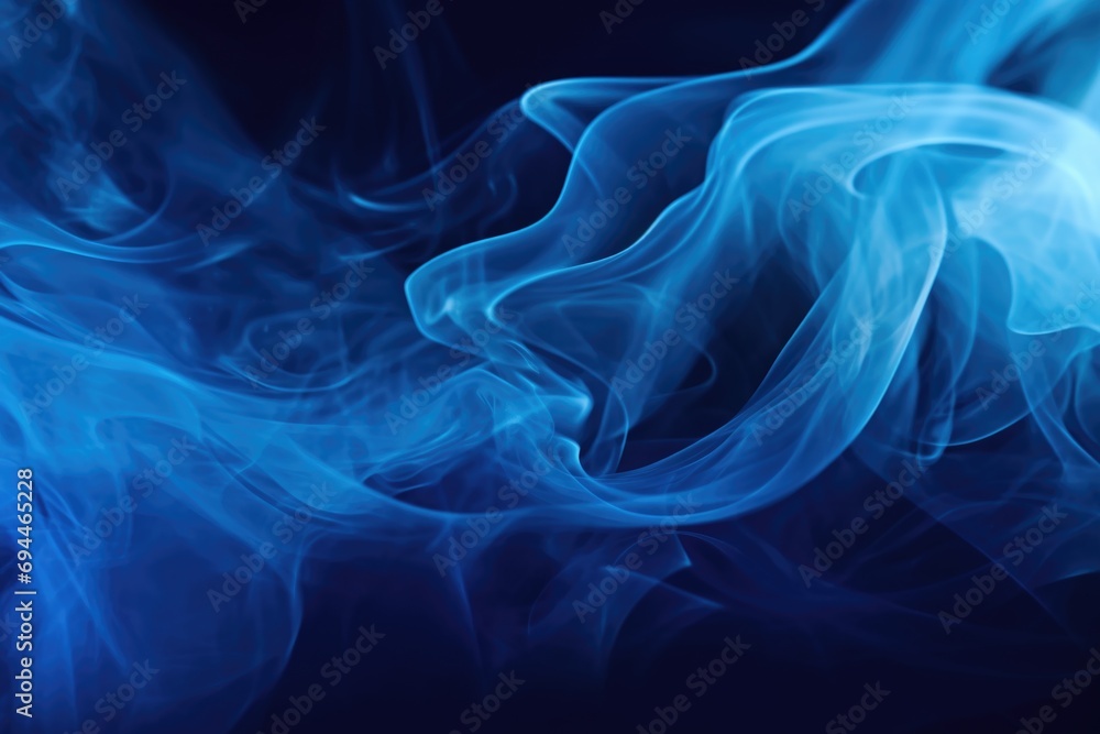 Fototapeta premium Blue smoke captured in a close-up shot on a black background. Perfect for adding a mysterious and captivating element to your designs or projects