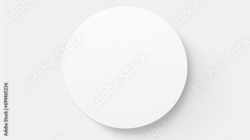 A white oval mirror hanging on a white wall. Perfect for interior design and home decor projects