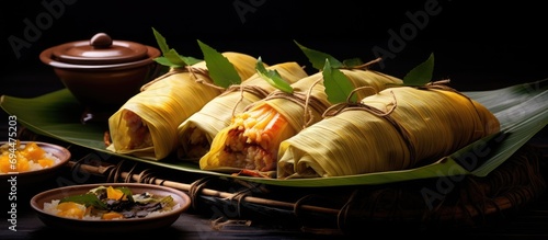 Colombian food wrapped in banana leaves, like the tamale, is a typical delicacy. photo