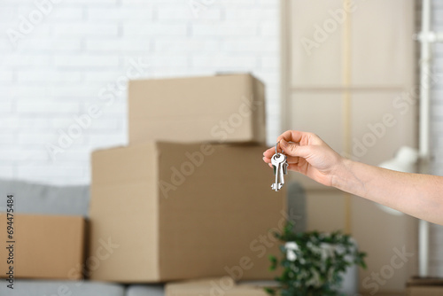 Woman with keys from her ne...
