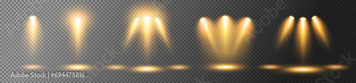 A set of spotlights to illuminate the stage with golden rays on a dark background. Luminous transparent lighting effects. Vector illustration.