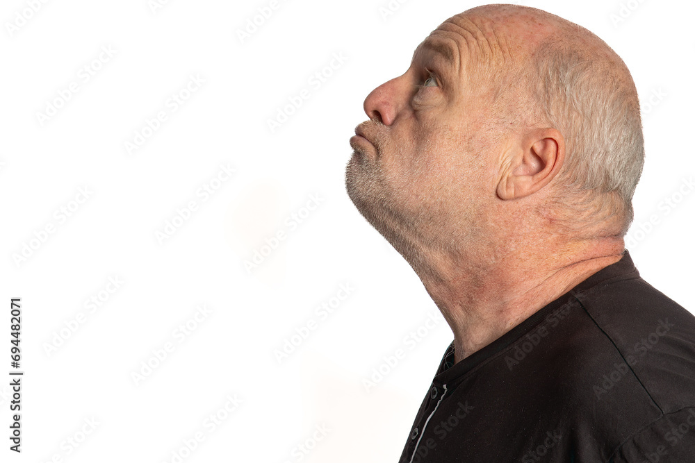Serene Mature White Male in Black Shirt, Profile Portrait on White Background Serene Mature White Male in Black Shirt, Profile Portrait on White Background