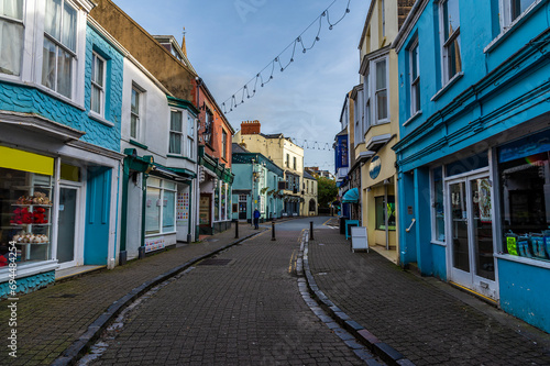 A view down Saint Georges Street away from the town walls in Tenby, Wales on a sunny day