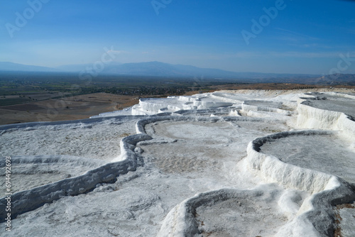 The white travertine, natural, thermal pools and terraces of Pamukkale, Turkey