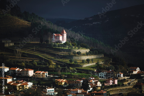 View of a village in the hills of the Douro Valley at dusk, Portugal. photo