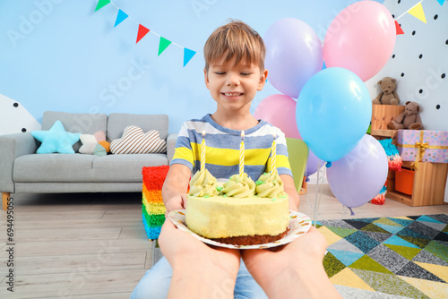 Cute little boy receiving B...