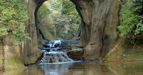 Water falls in Japan.Nomizo Falls and Kameiwa Cave are waterfalls that flow through the Kameiwa cave in Kimitsu City.Nomizo waterfall in kimitsu city. photo