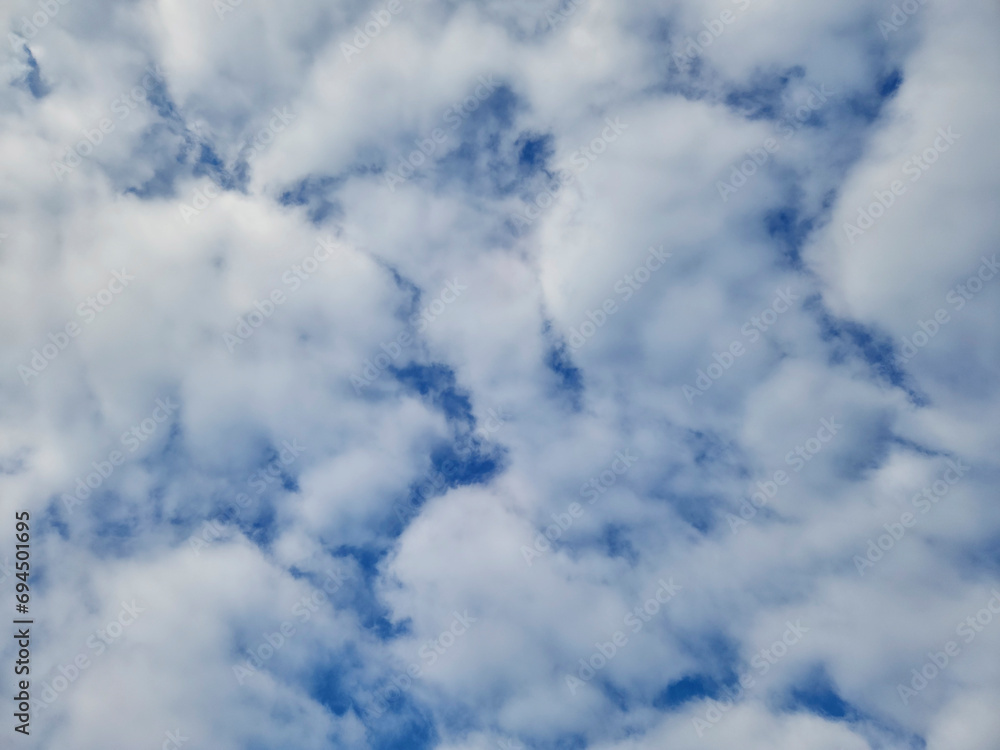 Bold white clouds in blue sky in December Bold white clouds in blue sky in December