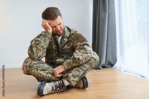 Crying professional soldier with depression and trauma after war
