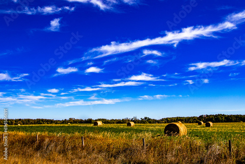Blue skies, ponds and farmers fields on a drive thru Lacombe County, Alberta, Canada