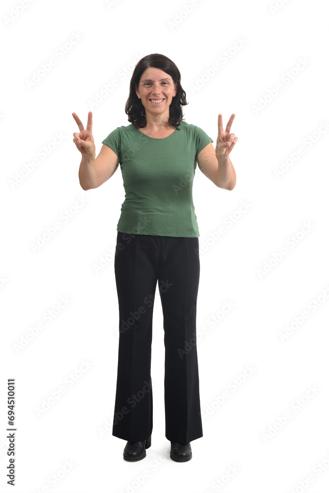 front view of a woman raising two arms showing the victory sign with her fingers on white background. front view of a woman raising two arms showing the victory sign with her fingers on white background.