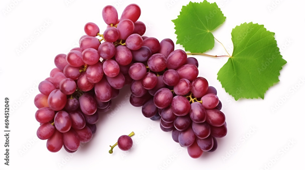 Isolated green-leaved red grapes, partly cut, viewed from above, on a white backdrop. Isolated green-leaved red grapes, partly cut, viewed from above, on a white backdrop.