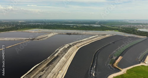 Aerial view of large open air phosphogypsum waste stack near Tampa, Florida. Potential danger of disposing byproduct of phosphate fertilizer production photo