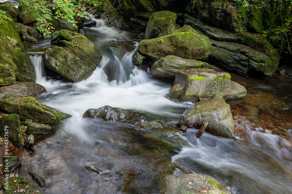 Long exposure of a waterfall on the East Lyn River at Watersmeet in Exmoor National Park