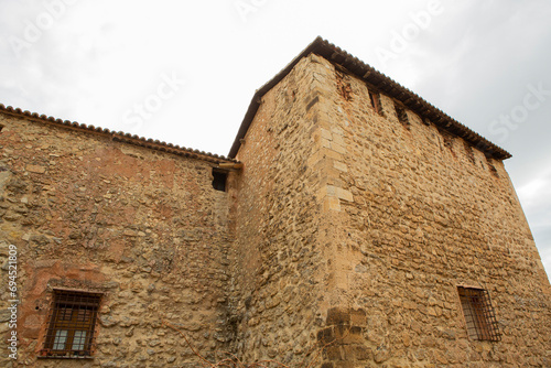 Stone walls of the ancient medieval village of Albarrac  n in Teruel  Spain .