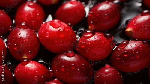  a close up of a bunch of red fruit with drops of water on the top and bottom of the fruit.