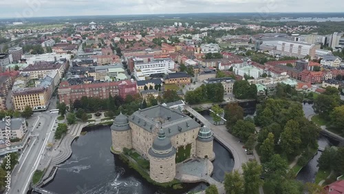 Old European Medieval Castle with a river as a moat, originally built in the 13th century, in the Center of a Swedish city seen from above