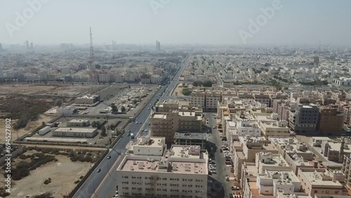 A sandy residential district in the Middle East as seen from above on a hot, sunny, cloudless day in Saudi Arabia