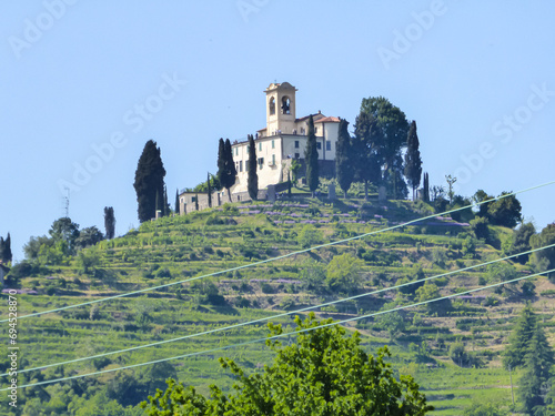Scenic view of a castle on the hill in Park of Montevecchia and Valle del Curone, Lecco, Lombardy, Italy, Europe. SANTUARIO DI MONTEVECCHIA in Northern Italy. Agritourism in tranquil atmopshere photo