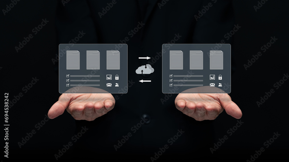 Businessman transferring backup business data to the cloud ,Backup data to the cloud ,Backing up data in multiple locations to prevent data loss.