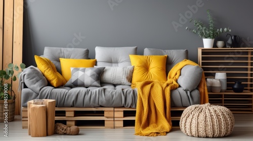 Design gray sofa, interior design of living room in yellow tones. Comfortable apartment. home decor.