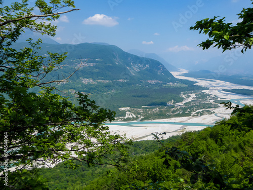 Scenic view of braided river Tagliamento running through mountainous landscape with in Friuli-Venezia Giulia  Italy  Europe. Clear blue water flowing in natural wilderness. Peaceful serene scene