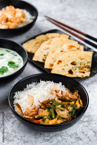 Rice with vegetables, tuna shavings and chicken fillet, kefir soup with greens and flatbread.