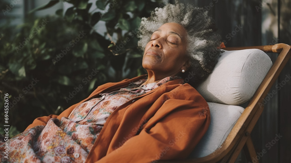 copy space, elderly black woman taking a nap on a pillow on background. National Napping Day. retired black woman resting while tired. Peaceful scene.
