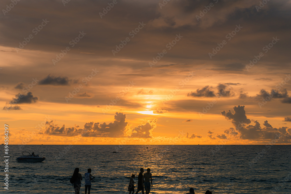 scene romantic sunset at Karon beach. abstract nature background..Sunset with bright color light rays and other atmospheric effects..Gradient color.cloudscape background in Phuket Thailand.