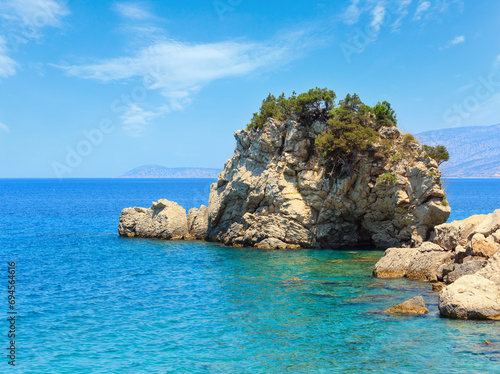 Summer sea coast landscape with interesting rock (the shape of a turtle). View from Mirror beach (Plazhi i Pasqyrave), Saranda, Albania. photo