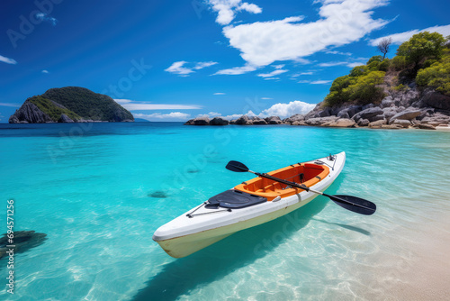 Kayak on the tropical white sand beach with transparent sea on sunny day