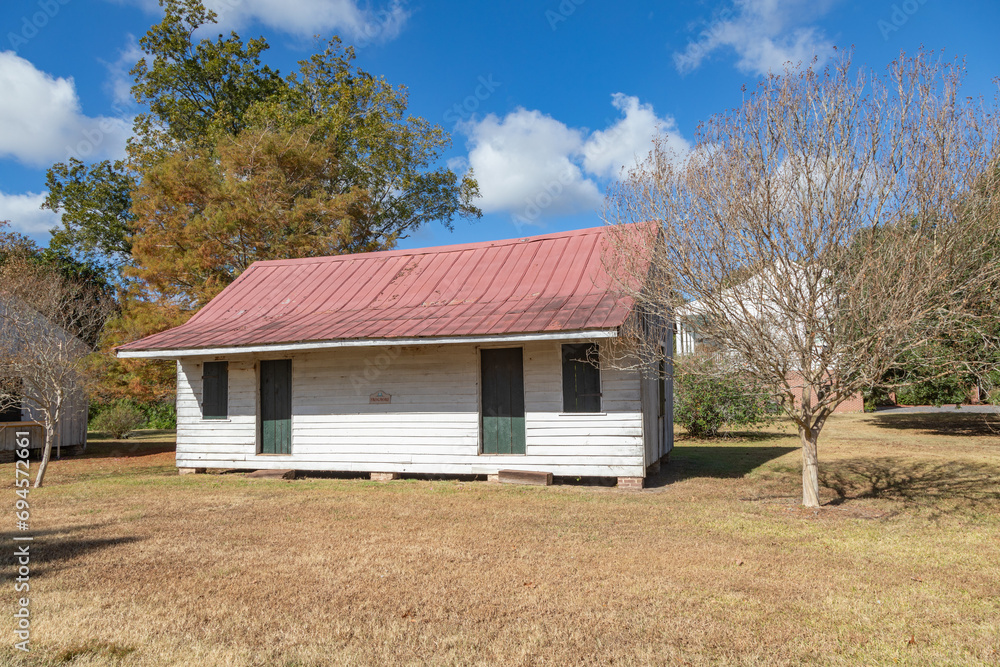 A White Clapboard Restored Slave Quarters Cabin on a Louisiana Cotton Plantation A White Clapboard Restored Slave Quarters Cabin on a Louisiana Cotton Plantation