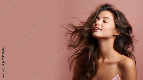 A brunette woman breathes calmly looking up isolated on pastel background