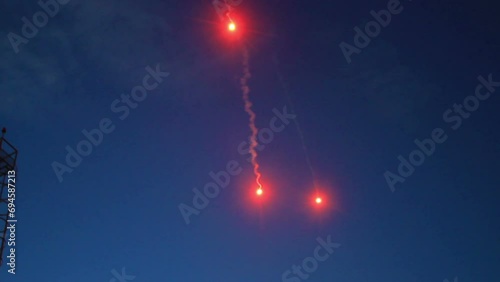 Flare - Emergency marine distress signals. Para illuminating rocket increases the visibility of conventional flares and keeps brightly burning aloft for up to 40 sec, can be seen from up to 15 km away photo