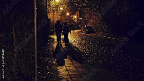 Pair of Young People Hanging Out on Late Evening Walking Across Dangerous Shabby Neighbourhood