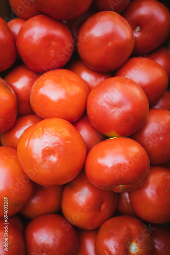 Top view of a group of red tomatoes in a greengrocer in Chile