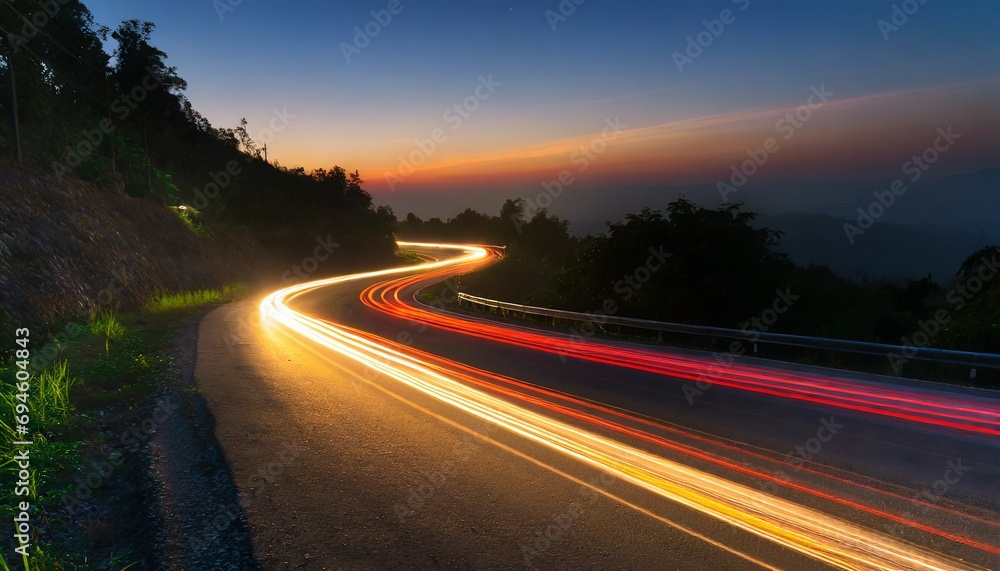 Car light trails on the road at night.
