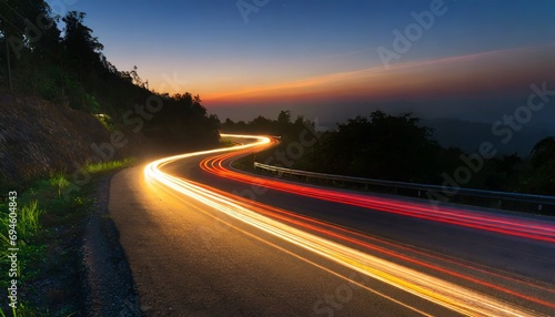 Car light trails on the road at night.