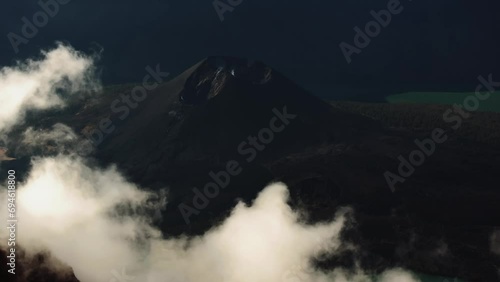 Active volcano Rinjani. Lombok. Indonesia. Drone flights over the crater. A lake with acid. Eruption. A pillar of smoke. High quality 4k drone footage