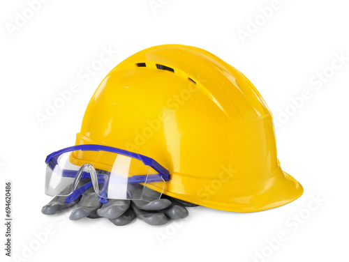 Hard hat, goggles and gloves isolated on white. Safety equipment