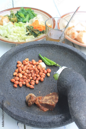 The ingredients for making Indonesian food called lotek are on the table photo