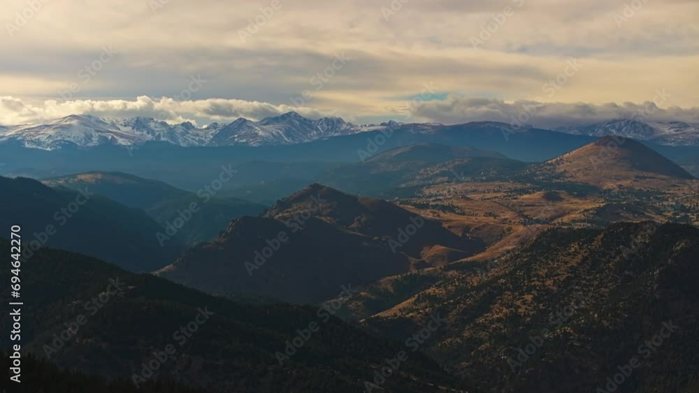 Sweeping mountain vista of forested foothills and snowy ridges of Lost Gulch Overlook Boulder Colorado at sunset Sweeping mountain vista of forested foothills and snowy ridges of Lost Gulch Overlook Boulder Colorado at sunset