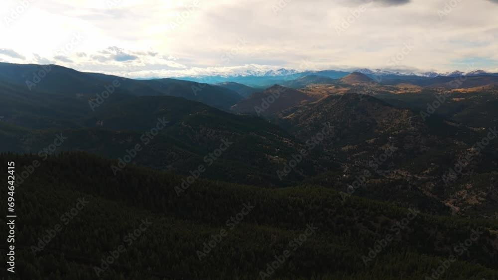 Panoramic aerial pullback over rolling mountain valleys in shadow of clouds at Lost Gulch Overlook Boulder Colorado Panoramic aerial pullback over rolling mountain valleys in shadow of clouds at Lost Gulch Overlook Boulder Colorado