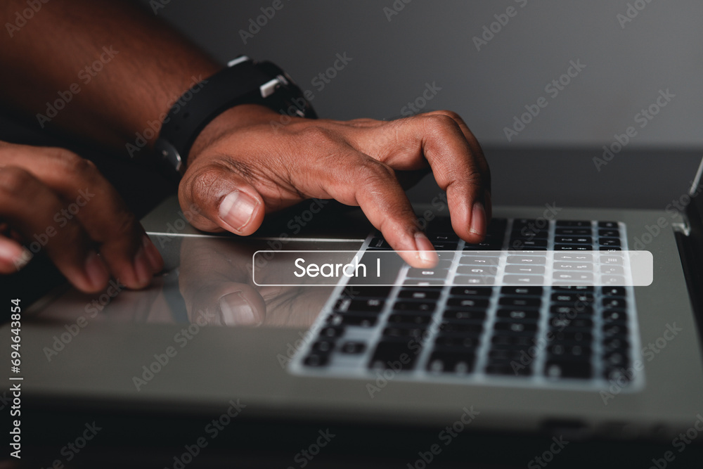 Fototapeta premium concept of information technology businessman or engineer search engine optimization Man's hand using computer keyboard to search for information. Using Search on your website. 