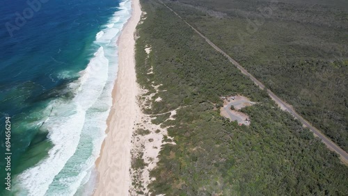 Mungo Brush Campground And Mungo Beach At Myall Lakes National Park In New South Wales, Australia. aerial tilt-up shot photo