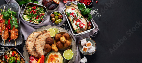 Photos Middle eastern or Arabic different dishes on black background