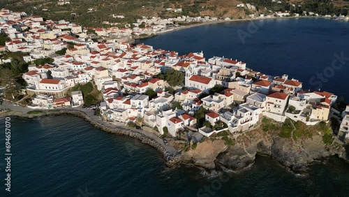 Aerial drone bird's eye view video of iconic and picturesque Andros island chora, Cyclades, Greece photo