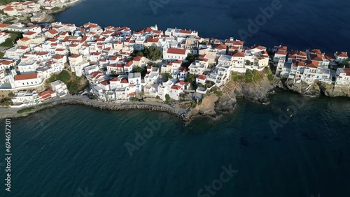 Aerial drone footage of iconic and picturesque Andros island chora, Cyclades, Greece photo