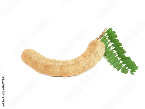 Fresh organic raw tamarind placed isolated on white background.