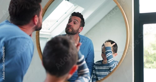 Hair, bathroom mirror and a father and child at home for hairstyle, imitate or self care. A happy man and a boy kid together in a family house for grooming, hygiene or happiness motivation in morning
